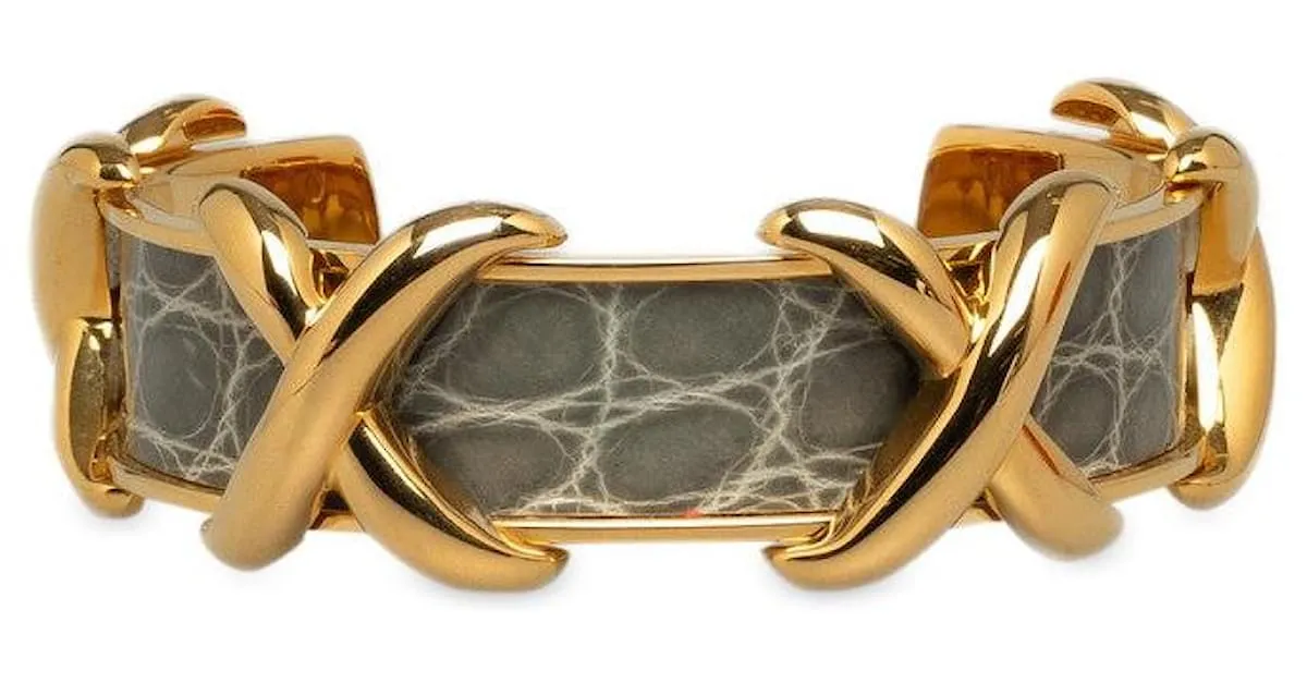 Brazalete de oro gris con motivo cruzado de Hermès en excelente estado Dorado 