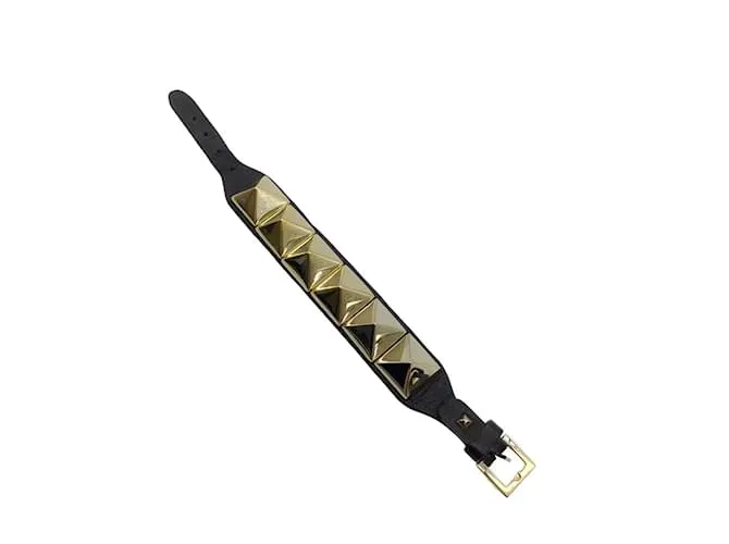 Valentino Garavani Brazalete Rockstuds grande de oro negro Valentino 